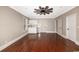 Spacious living room featuring wood floors, ceiling fan, and a convenient kitchenette area at 201 River Rd., Georgetown, SC 29440