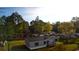 Aerial shot showcasing a single-story home with gray siding and black shutters surrounded by a lush green landscape at 2016 Misty Morning Dr., Conway, SC 29527