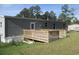Spacious backyard with a wooden deck, perfect for outdoor entertaining and relaxation at 2016 Misty Morning Dr., Conway, SC 29527