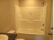 Bathroom with a white shower-tub combination unit and white toilet. Includes tile flooring and a shower head at 2016 Misty Morning Dr., Conway, SC 29527
