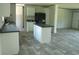 Modern kitchen with white cabinets, dark countertops, black appliances, and an island at 2016 Misty Morning Dr., Conway, SC 29527