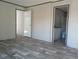 Spacious main bedroom featuring modern flooring, neutral walls, and an ensuite bathroom for added privacy at 2016 Misty Morning Dr., Conway, SC 29527