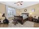 Cozy bedroom featuring a decorative rug, a ceiling fan, and lots of natural light from the windows at 208 Wahee Pl., Conway, SC 29527