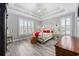 Bright bedroom with a decorative ceiling and large windows offering plenty of natural light at 208 Wahee Pl., Conway, SC 29527
