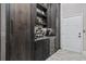 Convenient butler's pantry with beverage cooler, built-in shelving and plenty of storage space at 208 Wahee Pl., Conway, SC 29527