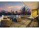 This home features a covered deck furnished with wicker seating and chaise lounges for enjoying the outdoors at 208 Wahee Pl., Conway, SC 29527
