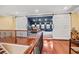 Second-floor view of the home theater with reclining seats, sliding doors, and hardwood flooring at 208 Wahee Pl., Conway, SC 29527