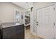 Functional laundry room with a washing machine, shelving, and a door to the pantry at 208 Wahee Pl., Conway, SC 29527
