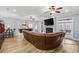 Open living room with hardwood floors, fireplace, and access to a gourmet kitchen at 208 Wahee Pl., Conway, SC 29527