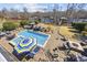 Aerial view of a private backyard with a pool, jacuzzi, lounge chairs, and beautiful landscaping at 208 Wahee Pl., Conway, SC 29527