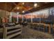 Relax in this screened-in porch with a swing bed, ample seating, and a dining area overlooking the backyard at 208 Wahee Pl., Conway, SC 29527