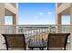 Balcony with chairs and a table overlooking the harbor at 2151 Bridge View Ct. # 1-1103, North Myrtle Beach, SC 29582