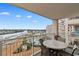 Relax on the spacious balcony with a view of the waterway and marina at 2151 Bridge View Ct. # 1-1103, North Myrtle Beach, SC 29582