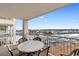 Balcony featuring a table and chairs overlooking the harbor and city at 2151 Bridge View Ct. # 1-1103, North Myrtle Beach, SC 29582