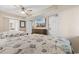 Bright bedroom featuring two beds, ceiling fan, and a flat screen television above a wooden dresser at 2151 Bridge View Ct. # 1-1103, North Myrtle Beach, SC 29582