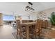 Open dining area with wooden table, statement lighting, and balcony access offering panoramic views at 2151 Bridge View Ct. # 1-1103, North Myrtle Beach, SC 29582