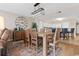 Well-lit dining area with wooden table, chairs, stylish light fixture, and kitchen access at 2151 Bridge View Ct. # 1-1103, North Myrtle Beach, SC 29582