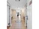 Condo entryway boasts tiled floors, nautical star design, and views of a well-lit living area at 2151 Bridge View Ct. # 1-1103, North Myrtle Beach, SC 29582