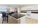 Kitchen with granite countertops, breakfast bar, and modern appliances overlooking the living room at 2151 Bridge View Ct. # 1-1103, North Myrtle Beach, SC 29582