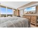 A comfortable main bedroom with sliding glass doors to a balcony and a flat screen TV at 2151 Bridge View Ct. # 1-1103, North Myrtle Beach, SC 29582