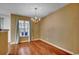 Dining area featuring hardwood floors and a chandelier hanging above the table at 2720 Marengo Ln. # 2720, Conway, SC 29526