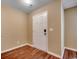 Neutral entryway featuring a six panel door and hardwood flooring at 2720 Marengo Ln. # 2720, Conway, SC 29526