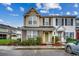 Two-story townhome with neutral siding, mulched beds and trimmed shrubs beneath a partly cloudy sky at 2720 Marengo Ln. # 2720, Conway, SC 29526