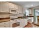 Well-lit kitchen features white appliances, countertops and ample storage space at 2720 Marengo Ln. # 2720, Conway, SC 29526