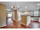 Bright kitchen with white cabinetry, an island, and hardwood floors at 2720 Marengo Ln. # 2720, Conway, SC 29526