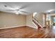 Spacious living room features hardwood floors and staircase leading to the second level at 2720 Marengo Ln. # 2720, Conway, SC 29526