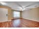 Sun-filled living room boasts hardwood floors, ceiling fan, and large front window at 2720 Marengo Ln. # 2720, Conway, SC 29526