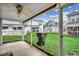 Enclosed patio with a view of the lawn and neighboring townhomes at 2720 Marengo Ln. # 2720, Conway, SC 29526