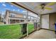 Enclosed patio with concrete floor, ceiling fan, and view of the lawn and neighboring townhomes at 2720 Marengo Ln. # 2720, Conway, SC 29526