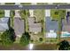 An aerial view of homes showcasing meticulously landscaped yards with a serene pond at 278 Tibton Circle, Myrtle Beach, SC 29588