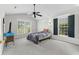 Bright bedroom with neutral walls, large windows, ceiling fan, and carpeted floors at 278 Tibton Circle, Myrtle Beach, SC 29588