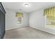This bedroom offers plush carpeting and ample natural light from two windows at 278 Tibton Circle, Myrtle Beach, SC 29588