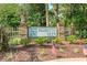 Attractive community sign for Palmetto Glen with landscaping and American flags at 278 Tibton Circle, Myrtle Beach, SC 29588