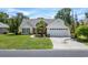 Beautiful home with a two-car garage, lovely landscaping, and a welcoming red front door at 278 Tibton Circle, Myrtle Beach, SC 29588