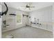Spare room featuring built-in shelving with a pegboard wall and a ceiling fan at 278 Tibton Circle, Myrtle Beach, SC 29588