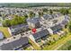 Aerial view showcases a community with a pond, pool, and well-maintained townhomes at 308 Golan Circle # A, Myrtle Beach, SC 29579