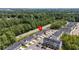 An aerial view highlights community townhomes near lush greenery and a convenient roadway at 308 Golan Circle # A, Myrtle Beach, SC 29579
