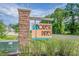 Community sign for Forest Pines featuring a stacked stone base and purple flowers at 308 Golan Circle # A, Myrtle Beach, SC 29579