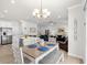 Open dining area featuring a modern table set, stylish lighting, and seamless living room access at 308 Golan Circle # A, Myrtle Beach, SC 29579