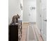 Inviting hallway with stylish decor and light wood floors, leading to a bright front door at 308 Golan Circle # A, Myrtle Beach, SC 29579