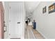 A bright hallway features stylish decor, white doors, and wood floors, offering a welcoming entrance at 308 Golan Circle # A, Myrtle Beach, SC 29579