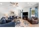 Cozy living room with a ceiling fan, modern decor, and a comfortable seating arrangement at 308 Golan Circle # A, Myrtle Beach, SC 29579
