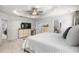 Large main bedroom has carpeted floors, TV, and a neutral palette, creating a bright and peaceful retreat at 308 Golan Circle # A, Myrtle Beach, SC 29579