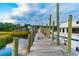 Picturesque waterfront community with private boat dock, perfect for enjoying nautical activities and scenic views at 308 Mayflower Dr., Calabash, NC 28467