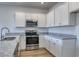 Kitchen featuring white cabinets, stainless steel appliances, and granite countertops at 308 Mayflower Dr., Calabash, NC 28467