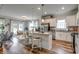 Well-lit kitchen featuring granite countertops, stainless steel appliances, and an island with bar stool seating at 308 Mayflower Dr., Calabash, NC 28467